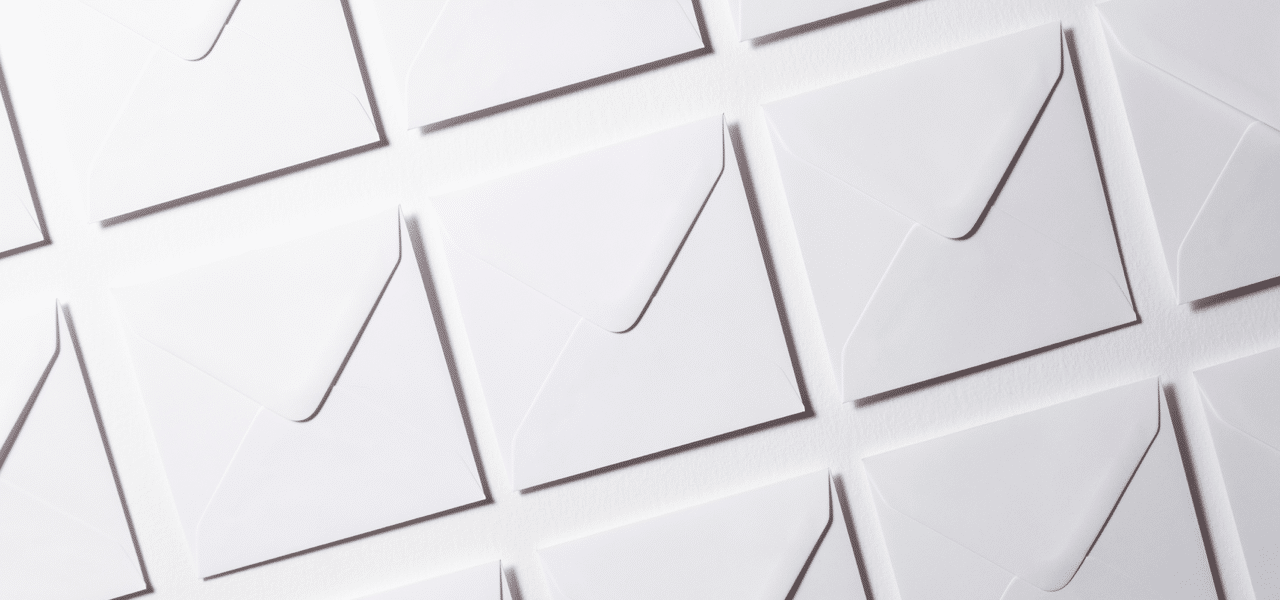 Rows of several white envelopes